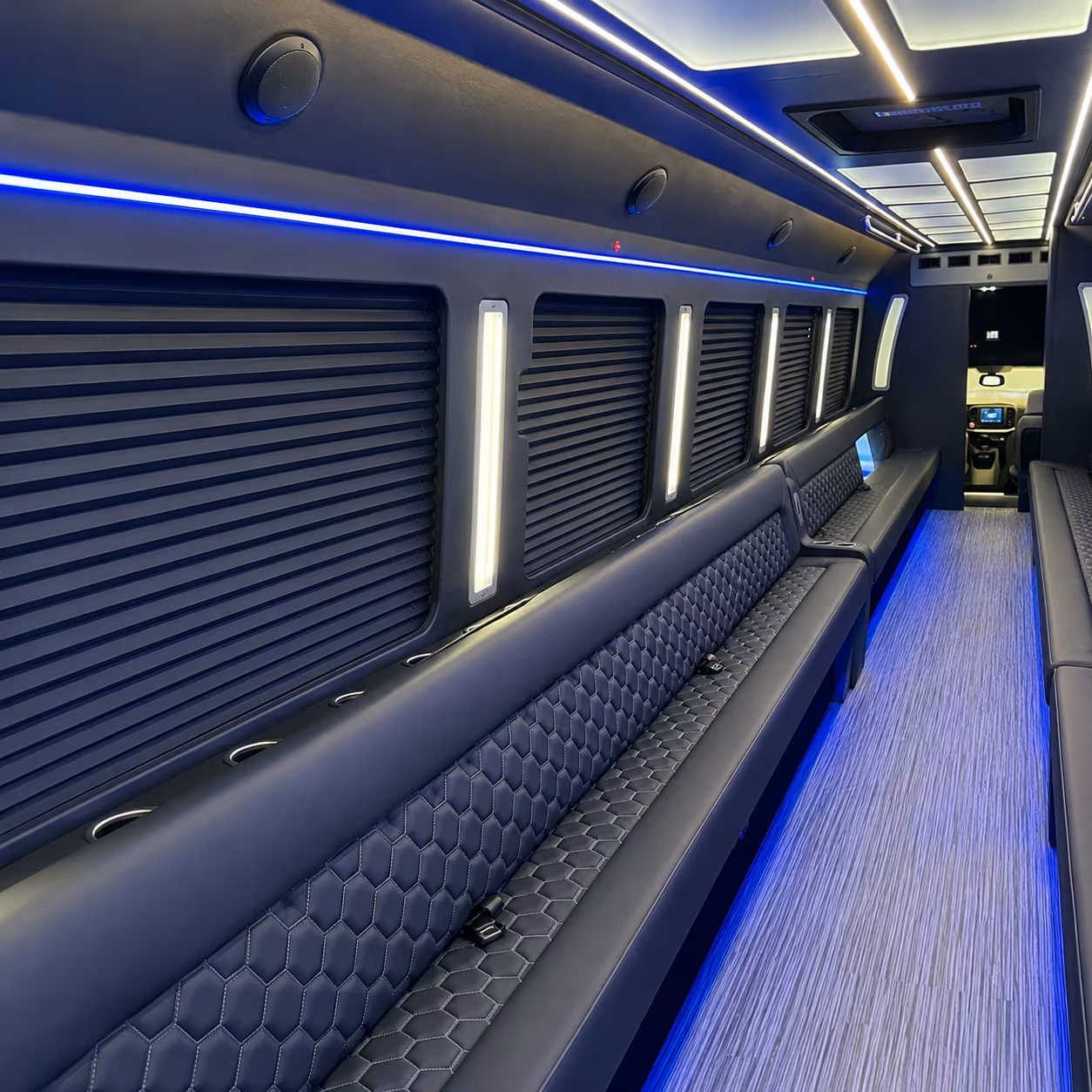 Friends laughing during a party bus celebration in McKinney