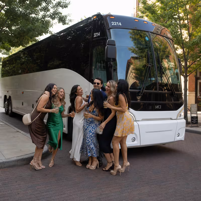 Passengers loading luggage while boarding an McKinney group shuttle