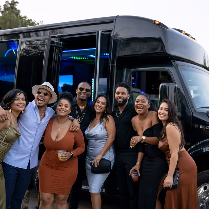 Group boarding a white charter bus for Birthday Transportation transportation in McKinney