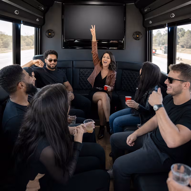 Group boarding a white charter bus for Concert Transportation transportation in McKinney