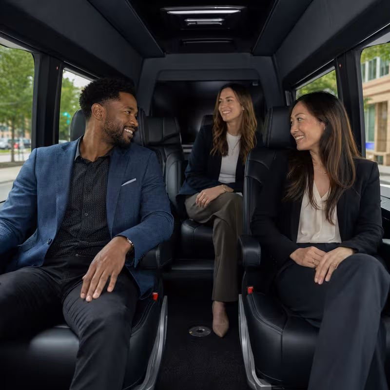 Group boarding a white charter bus for Corporate Transportation transportation in McKinney