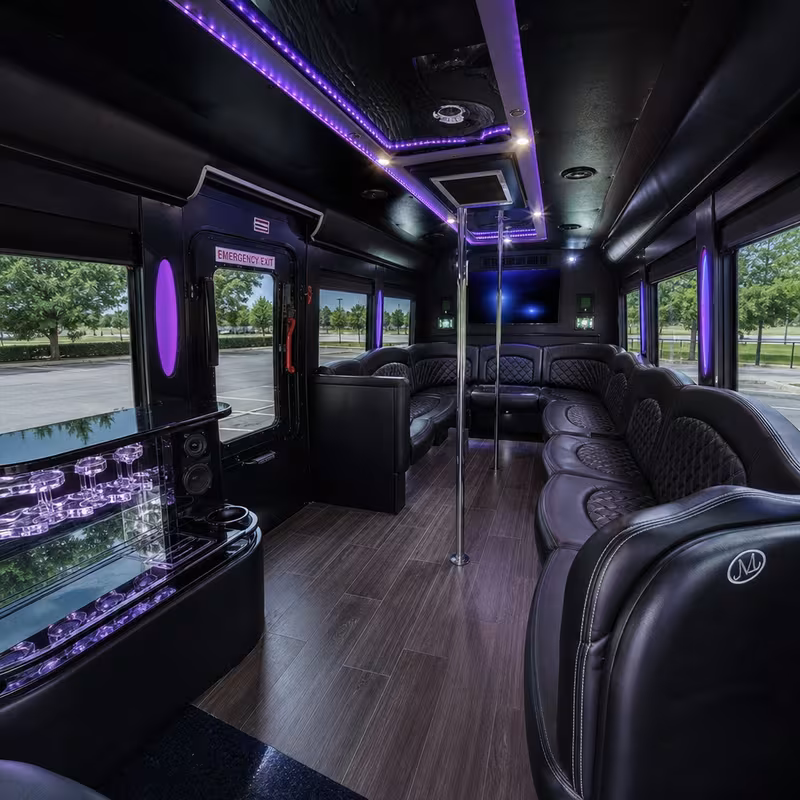 Party bus interior with wraparound leather seating and LED lighting in McKinney