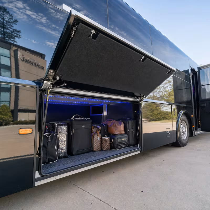 Party bus interior with wraparound leather seating and LED lighting in McKinney
