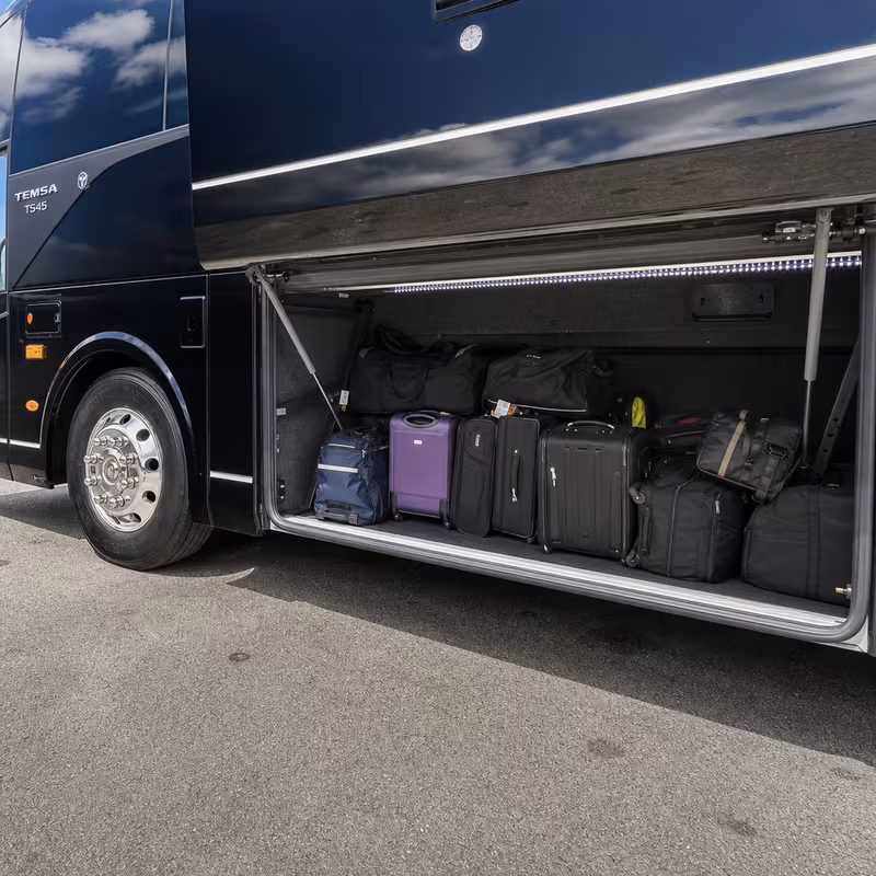 Party bus interior with wraparound leather seating and LED lighting in McKinney